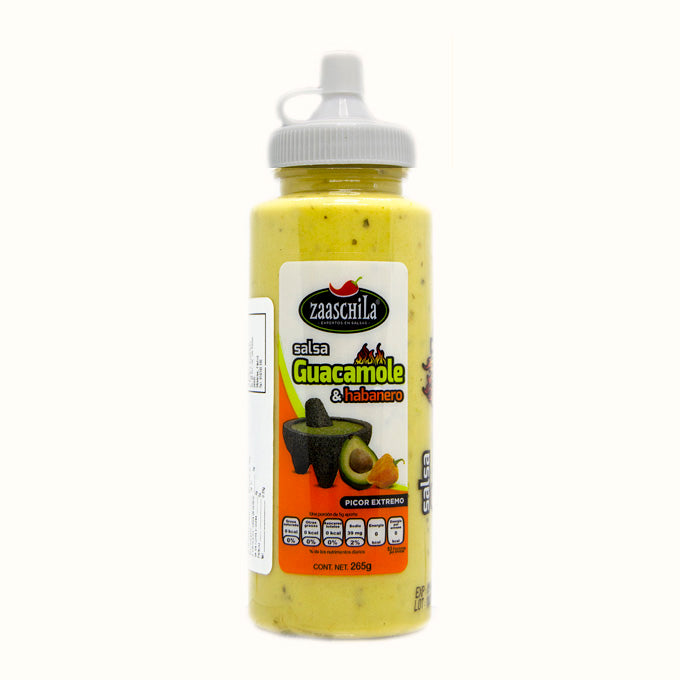 Envase plástico transparente con dosificador blanco. Etiqueta blanca y naranja de la marca zaaschila con etiquetado e imagen de un molcajete con aguacate y chile anaranjado.