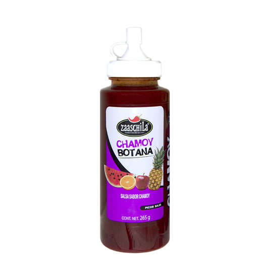 Envase plástico transparente con dosificador blanco. Etiqueta blanca y morada de la marca zaaschila con etiquetado e imágenes de frutas.